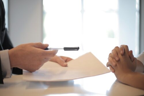 handing over paperwork