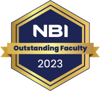 Hexagonal badge with a navy blue background, gold border, and the text "NBI Outstanding Faculty 2023" in white and gold. A gold ribbon runs horizontally through the middle.