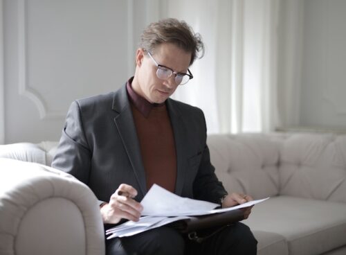 man looking over documents